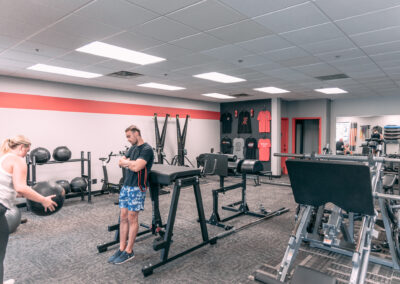 A man standing in front of some gym equipment.