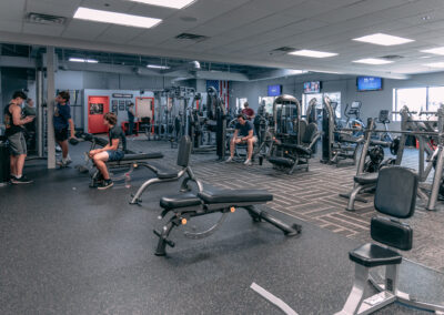 A gym with people working out in it