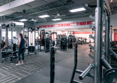 A gym with people working out in it