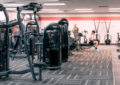 A gym with people working out in it