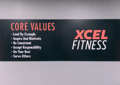 A sign that says core values and xcel fitness.